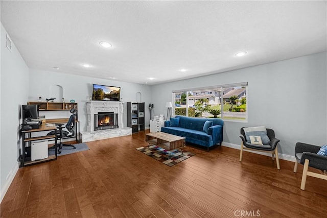 5345 Kenwood Ave, Buena Park, CA 90621 - living area with wood finished floors, baseboards, a high end fireplace, recessed lighting, and an office area