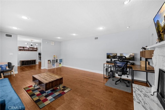 5345 Kenwood Ave, Buena Park, CA 90621 - living room with a fireplace, an office area, recessed lighting, wood finished floors, and baseboards