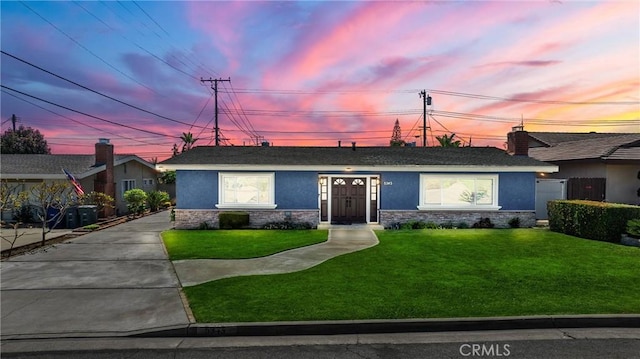 5345 Kenwood Ave, Buena Park, CA 90621 - ranch-style house featuring stucco siding, stone siding, and a front lawn