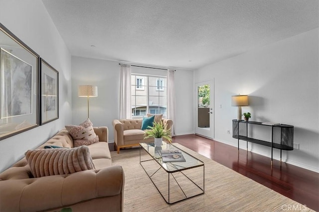 2750 Artesia Blvd Unit 337, Redondo Beach, CA 90278 - living room with wood finished floors, a textured ceiling, and baseboards