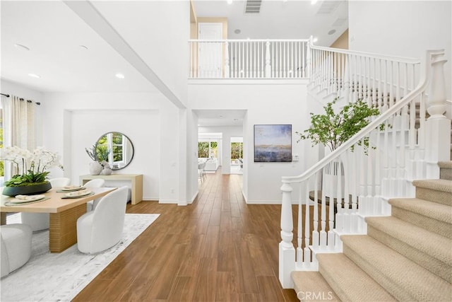 103 Sparrow, Irvine, CA 92618 - foyer with stairs, wood finished floors, baseboards, and a high ceiling