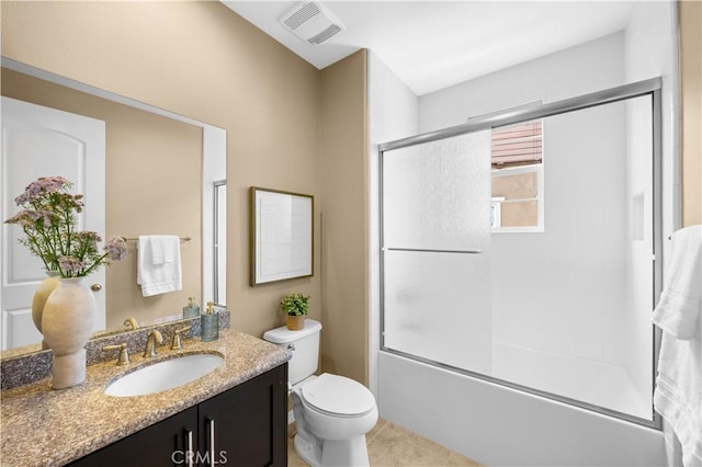 103 Sparrow, Irvine, CA 92618 - bathroom with vanity, combined bath / shower with glass door, toilet, and tile patterned flooring
