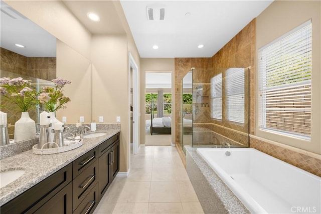 103 Sparrow, Irvine, CA 92618 - ensuite bathroom featuring a bath, double vanity, tile patterned floors, a tile shower, and recessed lighting
