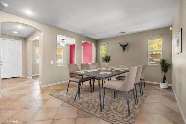 2123 Coconut Pl, Palmdale, CA 93551 - dining space with arched walkways, light tile patterned floors, a ceiling fan, and recessed lighting