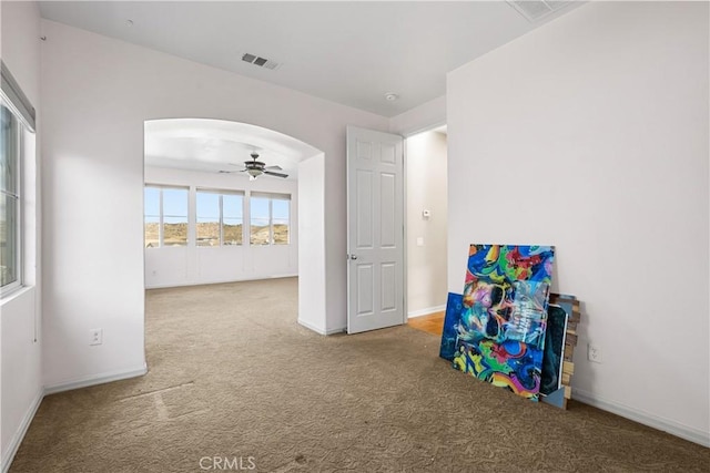 2123 Coconut Pl, Palmdale, CA 93551 - recreation room featuring carpet floors, arched walkways, and ceiling fan
