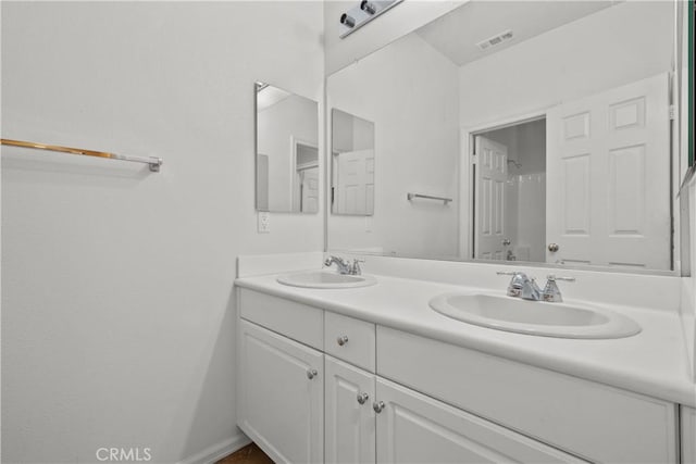 2123 Coconut Pl, Palmdale, CA 93551 - bathroom with double vanity and baseboards