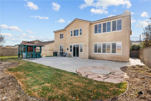2123 Coconut Pl, Palmdale, CA 93551 - rear view of property featuring a gazebo, stucco siding, a patio area, and a fenced backyard