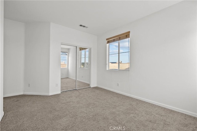 2123 Coconut Pl, Palmdale, CA 93551 - unfurnished bedroom featuring carpet flooring and a closet