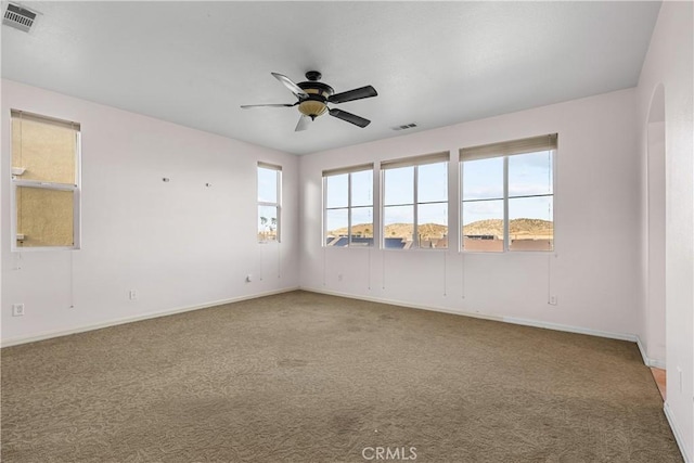 2123 Coconut Pl, Palmdale, CA 93551 - carpeted spare room with a ceiling fan and arched walkways