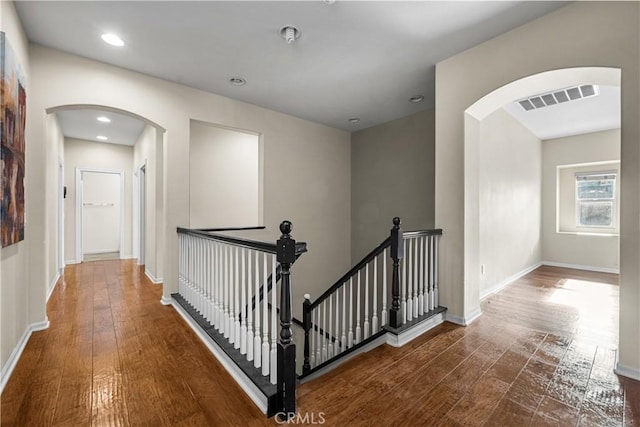 2123 Coconut Pl, Palmdale, CA 93551 - corridor with an upstairs landing, arched walkways, hardwood / wood-style flooring, and recessed lighting