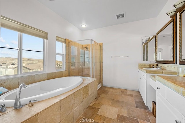 2123 Coconut Pl, Palmdale, CA 93551 - bathroom with a shower stall, a bath, vanity, and stone tile flooring