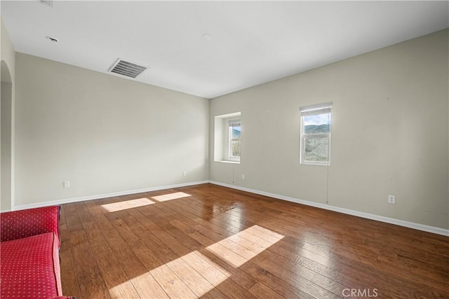 2123 Coconut Pl, Palmdale, CA 93551 - empty room with hardwood / wood-style flooring and arched walkways
