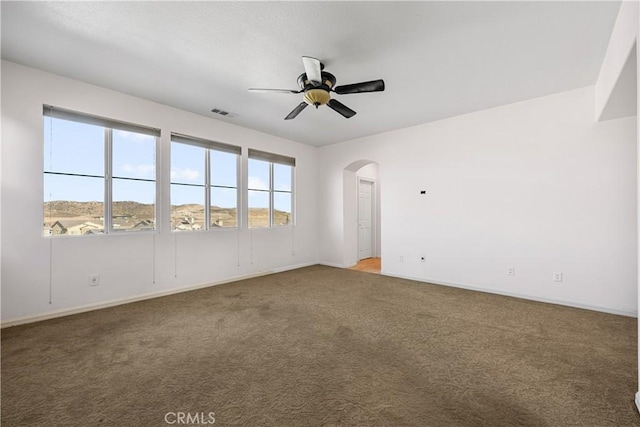 2123 Coconut Pl, Palmdale, CA 93551 - carpeted empty room with ceiling fan and arched walkways