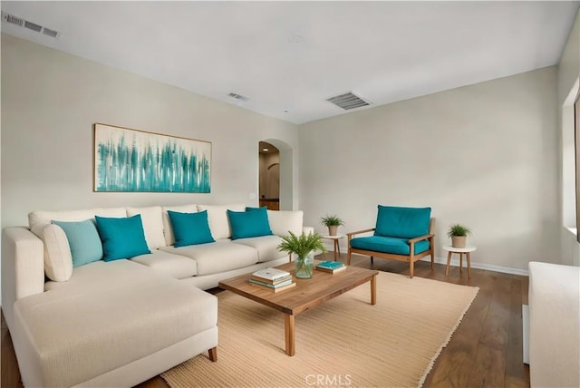 2123 Coconut Pl, Palmdale, CA 93551 - living room with arched walkways and wood-type flooring