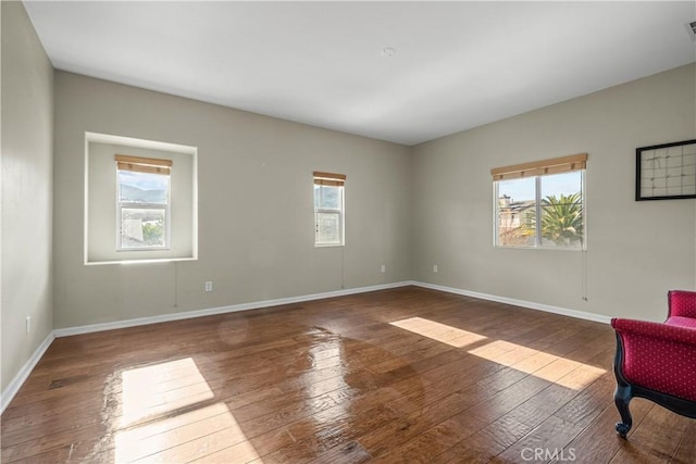 2123 Coconut Pl, Palmdale, CA 93551 - unfurnished room featuring healthy amount of natural light and hardwood / wood-style flooring