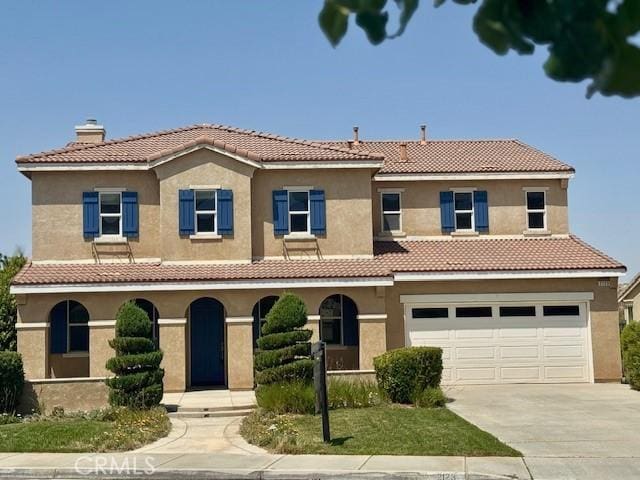 2123 Coconut Pl, Palmdale, CA 93551 - view of front facade featuring driveway, covered porch, a garage, a chimney, and stucco siding