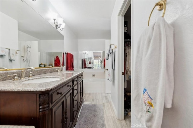 2482 Limestone Ct, Chino Hills, CA 91709 - full bathroom featuring double vanity and a garden tub