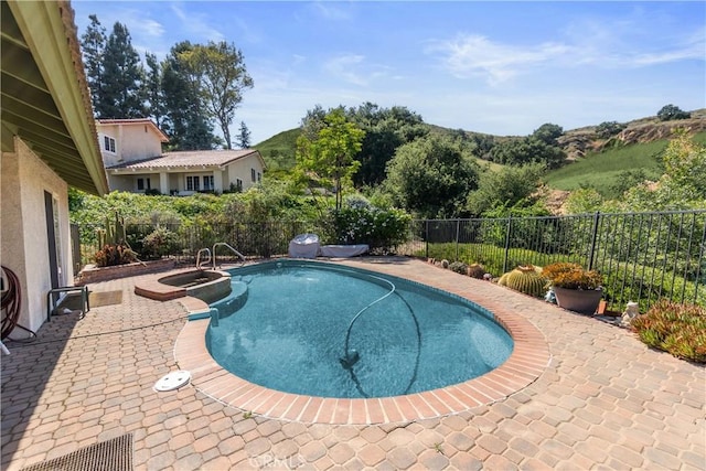 2482 Limestone Ct, Chino Hills, CA 91709 - view of swimming pool with a pool with connected hot tub, a fenced backyard, and a patio area