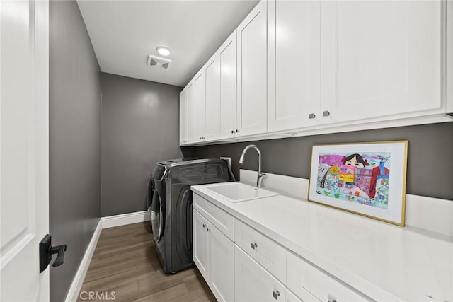 1279 Waterbrook Cir, Walnut, CA 91789 - washroom with independent washer and dryer, cabinet space, light wood-type flooring, and baseboards