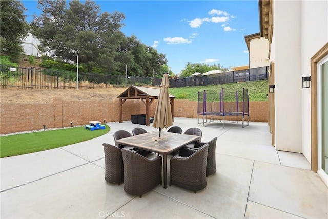 1279 Waterbrook Cir, Walnut, CA 91789 - fenced backyard featuring a trampoline, a patio, and outdoor dining space