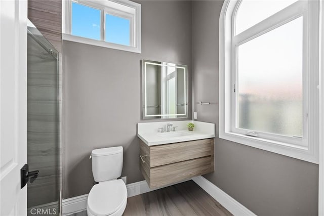 1279 Waterbrook Cir, Walnut, CA 91789 - full bath with toilet, vanity, baseboards, wood finished floors, and an enclosed shower