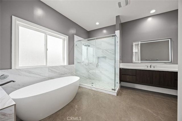1279 Waterbrook Cir, Walnut, CA 91789 - full bath with vanity, a soaking tub, a marble finish shower, and tile walls