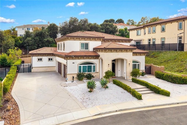 1279 Waterbrook Cir, Walnut, CA 91789 - mediterranean / spanish-style house featuring stucco siding, a tiled roof, concrete driveway, and a garage