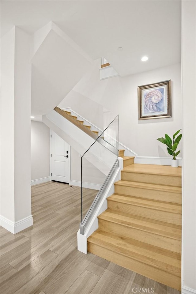1279 Waterbrook Cir, Walnut, CA 91789 - stairs featuring wood finished floors, baseboards, and recessed lighting