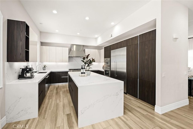 1279 Waterbrook Cir, Walnut, CA 91789 - kitchen with wall chimney range hood, modern cabinets, stainless steel built in fridge, a center island, and open shelves