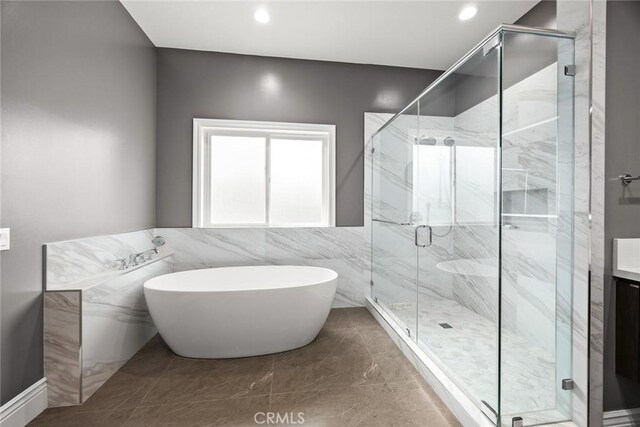 1279 Waterbrook Cir, Walnut, CA 91789 - full bath featuring a freestanding bath, a marble finish shower, vanity, recessed lighting, and tile walls