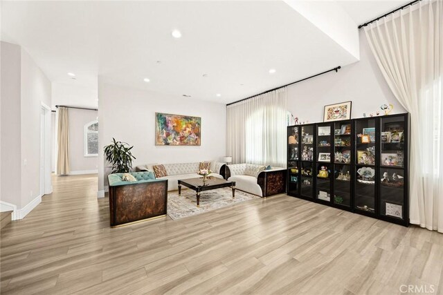 1279 Waterbrook Cir, Walnut, CA 91789 - living room with wood finished floors, recessed lighting, healthy amount of natural light, and baseboards