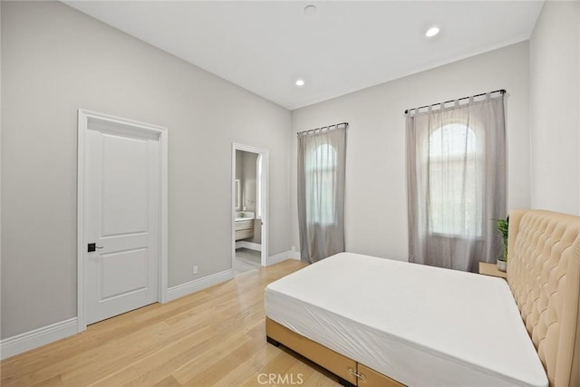 1279 Waterbrook Cir, Walnut, CA 91789 - bedroom featuring light wood-style floors, baseboards, recessed lighting, and connected bathroom