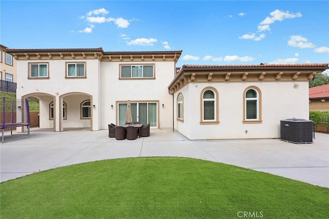 1279 Waterbrook Cir, Walnut, CA 91789 - back of house with central air condition unit, a patio, stucco siding, and a trampoline