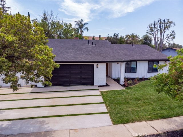 876 Ballina Ct, Newbury Park, CA 91320 - ranch-style home featuring an attached garage, concrete driveway, a front lawn, and a shingled roof
