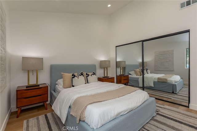876 Ballina Ct, Newbury Park, CA 91320 - bedroom featuring wood finished floors, baseboards, recessed lighting, and a towering ceiling