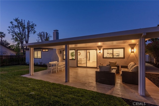 876 Ballina Ct, Newbury Park, CA 91320 - back of house with an outdoor hangout area, a patio, a chimney, and stucco siding