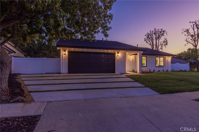 876 Ballina Ct, Newbury Park, CA 91320 - ranch-style house featuring asphalt driveway, an attached garage, and brick siding