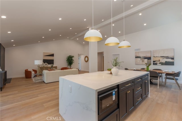 876 Ballina Ct, Newbury Park, CA 91320 - kitchen featuring black microwave, light wood-style floors, recessed lighting, a center island, and high vaulted ceiling