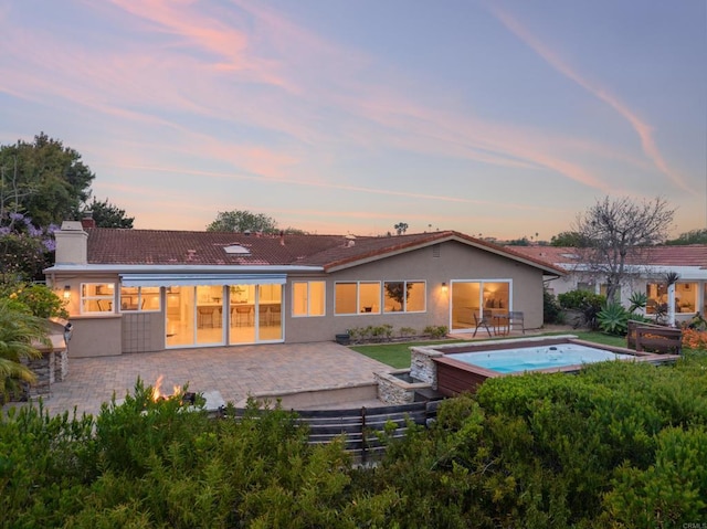 1695 Alta La Jolla Dr, La Jolla, CA 92037 - rear view of house featuring a hot tub, a patio, a chimney, and stucco siding