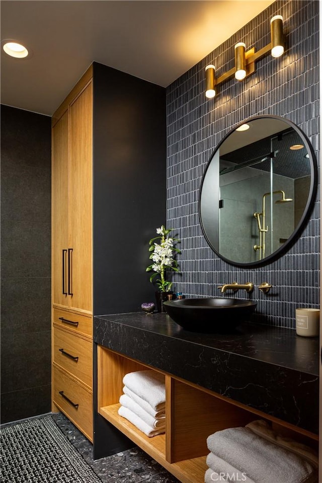 425 Tustin Ave, Newport Beach, CA 92663 - bathroom featuring tile walls, vanity, recessed lighting, decorative backsplash, and a shower