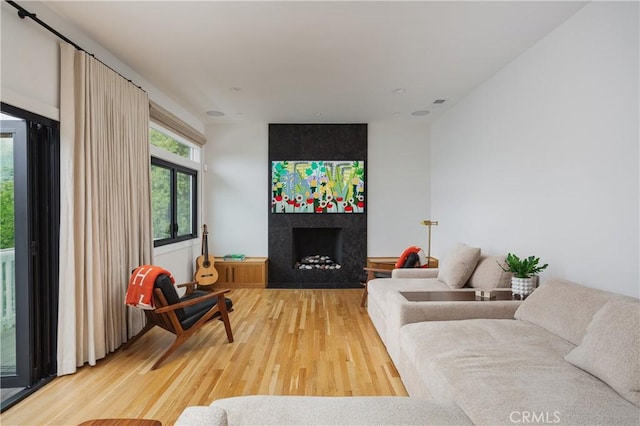 425 Tustin Ave, Newport Beach, CA 92663 - living area featuring light wood-style floors and a fireplace