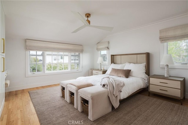425 Tustin Ave, Newport Beach, CA 92663 - bedroom with multiple windows, wood finished floors, vaulted ceiling, ornamental molding, and a ceiling fan