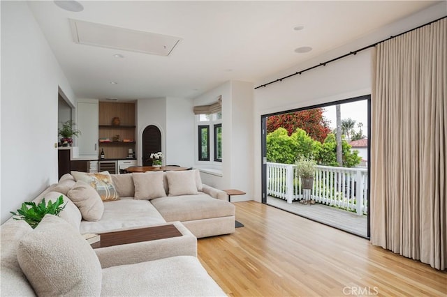 425 Tustin Ave, Newport Beach, CA 92663 - living room with light wood-style flooring, healthy amount of natural light, attic access, and beverage cooler