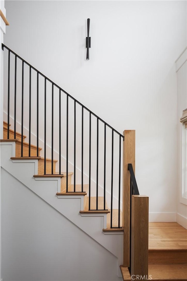 425 Tustin Ave, Newport Beach, CA 92663 - stairway featuring baseboards and wood finished floors