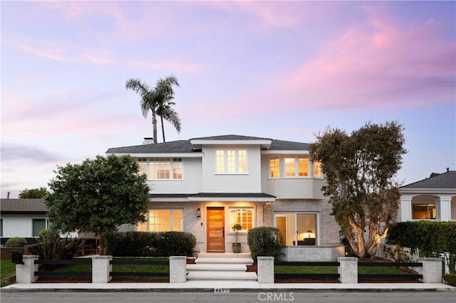 425 Tustin Ave, Newport Beach, CA 92663 - view of front of home featuring a fenced front yard and stucco siding