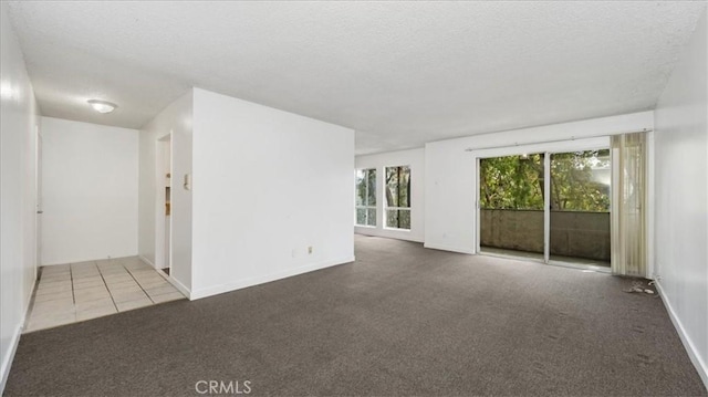 3649 Glendon Ave Unit 202, Los Angeles, CA 90034 - empty room featuring carpet floors, a textured ceiling, and baseboards