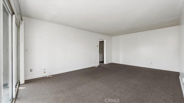 3649 Glendon Ave Unit 202, Los Angeles, CA 90034 - empty room featuring dark colored carpet and baseboards