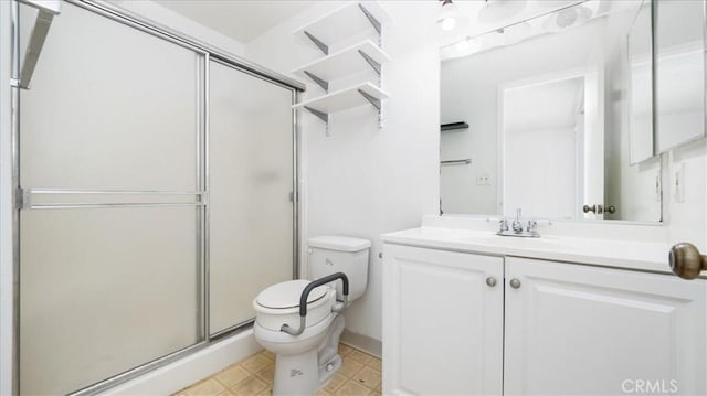 3649 Glendon Ave Unit 202, Los Angeles, CA 90034 - bathroom featuring toilet, vanity, and a shower stall