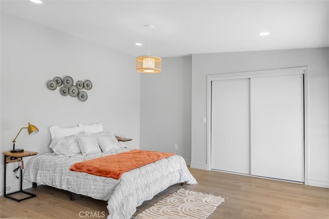 11707 Pendleton Rd, Yucaipa, CA 92399 - bedroom with light wood finished floors, recessed lighting, and a closet