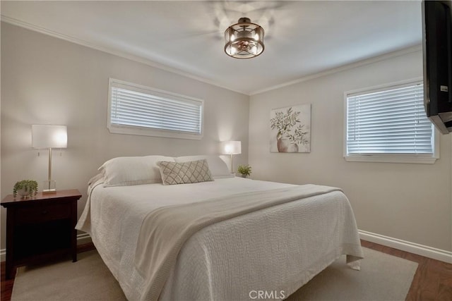 7642 Rhone Ln, Huntington Beach, CA 92647 - bedroom with wood finished floors, multiple windows, baseboards, and ornamental molding